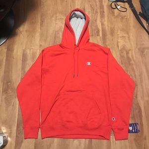 Red champion hoodie.